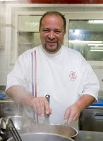 French cook Gilles Goujon, poses in the kitchen of his restaurant, "L'Auberge du Vieux Puits", in the village of Fontjoncouse, south of France, Monday, March 1, 2010. There are three new stars in the firmament of French gastronomy: "L'Auberge du Vieux Puits" has climbed to the Michelin Red Guide's top ranking, where it joins 25 others at the summit of fine dining, Michelin announced Monday. (AP Photo/Jean Paul Bonincontro)