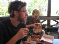 In this June 2, 2011 photo Josiah "Mehap" Cilladi of Parkesburg, Pa., left, and Tim "Grasshopper" Trickel of Raleigh, N.C., eat half-gallons of Hershey's ice cream at Pine Grove Furnace State Park in Gardners, Pa. For decades, Appalachian Trail thru-hikers arriving at the midway point of the Georgia-to-Maine footpath have made it a tradition to stop at the park in southcentral Pennsylvania and eat an entire brick of ice cream. (AP Photo/Michael Rubinkam)